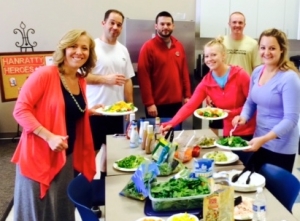 Yoga hour ends with a Salad Bar in the offices of Hanratty & Associates.