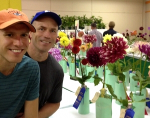 George (center) and his husband Jake are Minnesota State Champion Dalia growers.