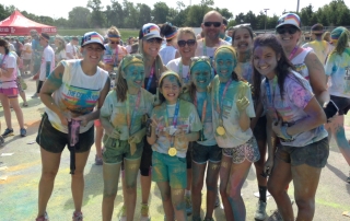 Along with teaching life lessons early, Heidi stays connected to her family by being active. Here she is with family and friends at the Color Run!