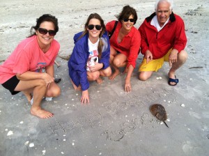 Colleen (in red) spends "as much time as possible" with family at their home on Sanibel Island. This picture celebrates her father's birthday.